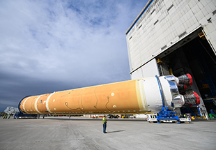 Picture of S L S rocket being transported out of hangar. Space Launch System