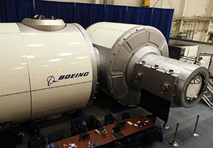 Picture of the moon-orbiting Boeing Gateway exterior section inside a hangar. Gateway